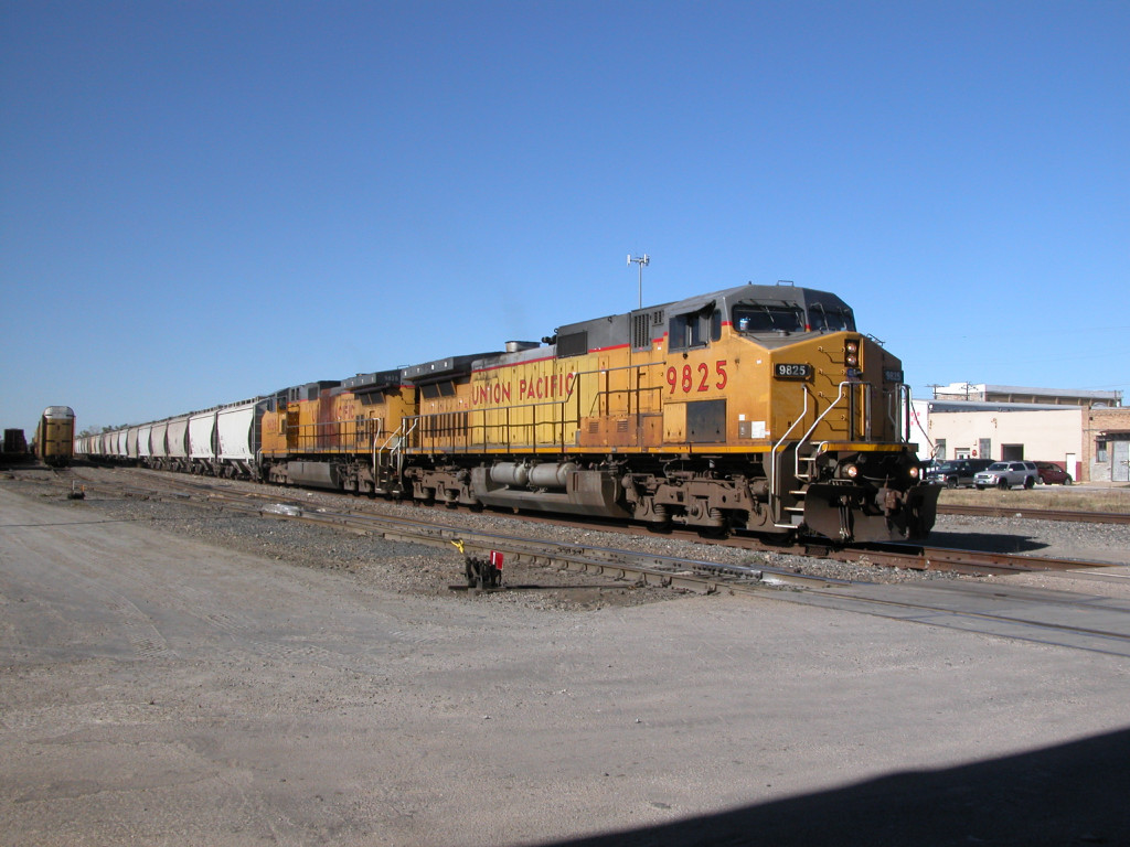 UP 9825  20Dec2012  EB through the yard approaching Main Street